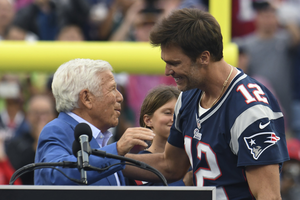 Tom Brady (L) hugs Robert Kraft during a tribute to the QB in Sept. 2023.