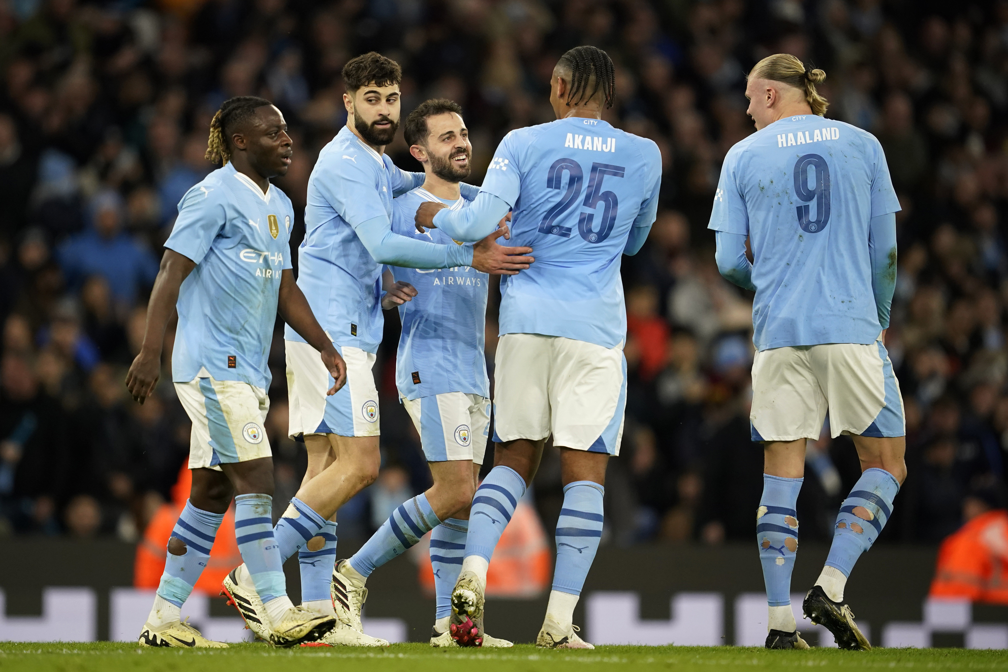 Manchester Citys Bernardo Silva celebrates with his teammates after scoring his sides second