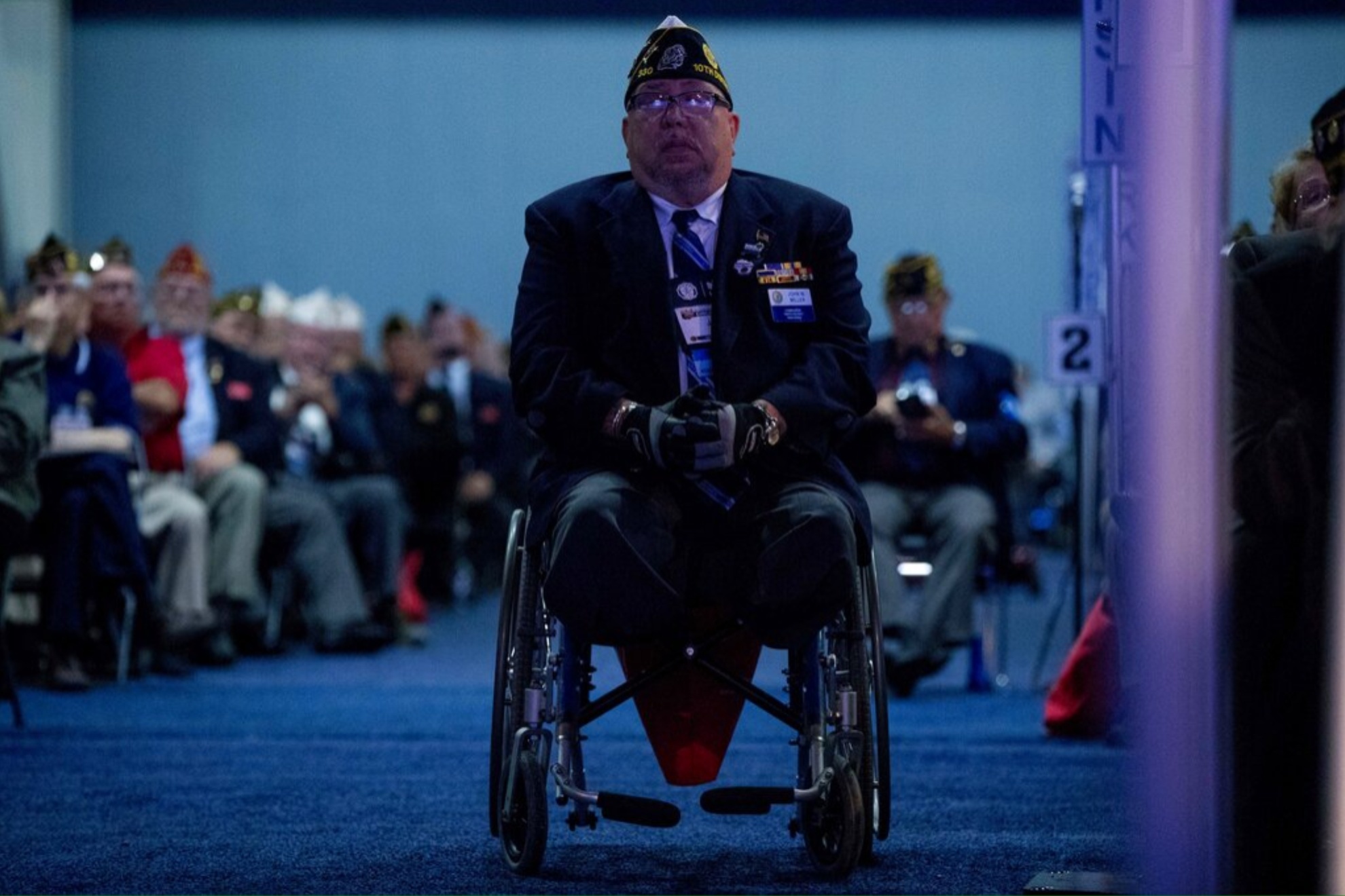 A member of the American Legion sits in his wheelchair.