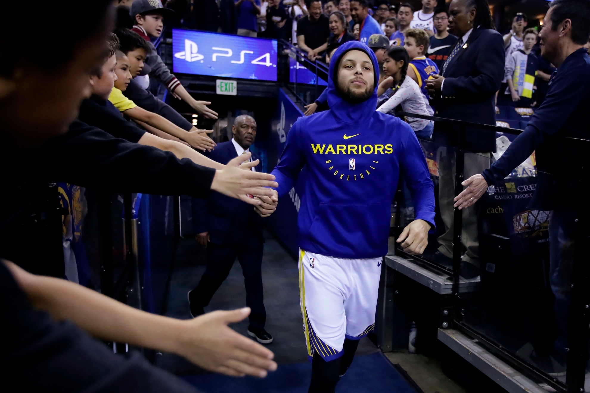 Stephen Curry enters the court