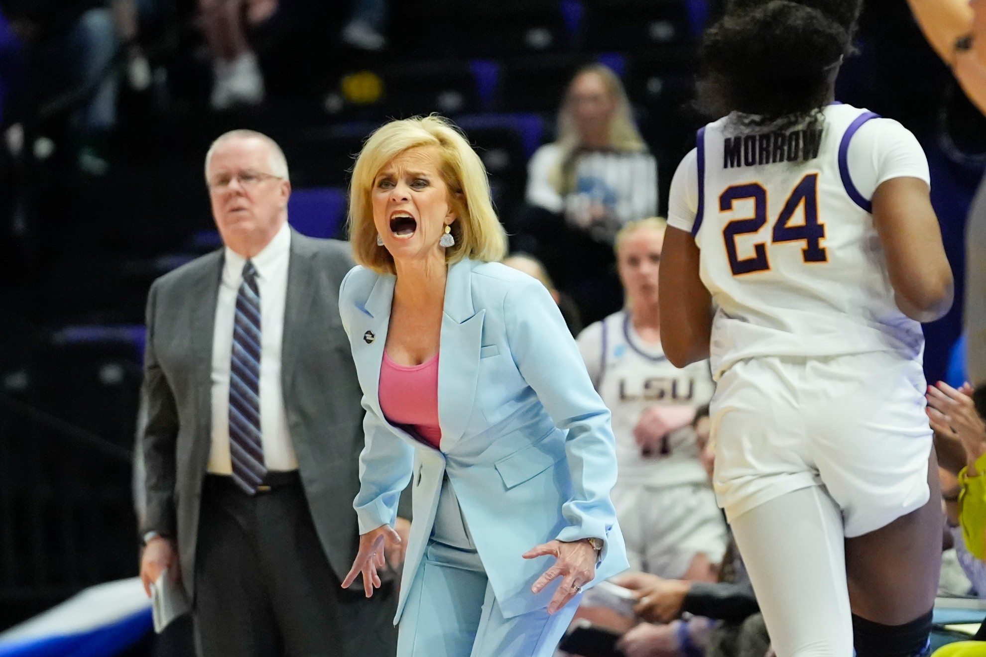 LSU head coach Kim Mulkey calls out from the bench.
