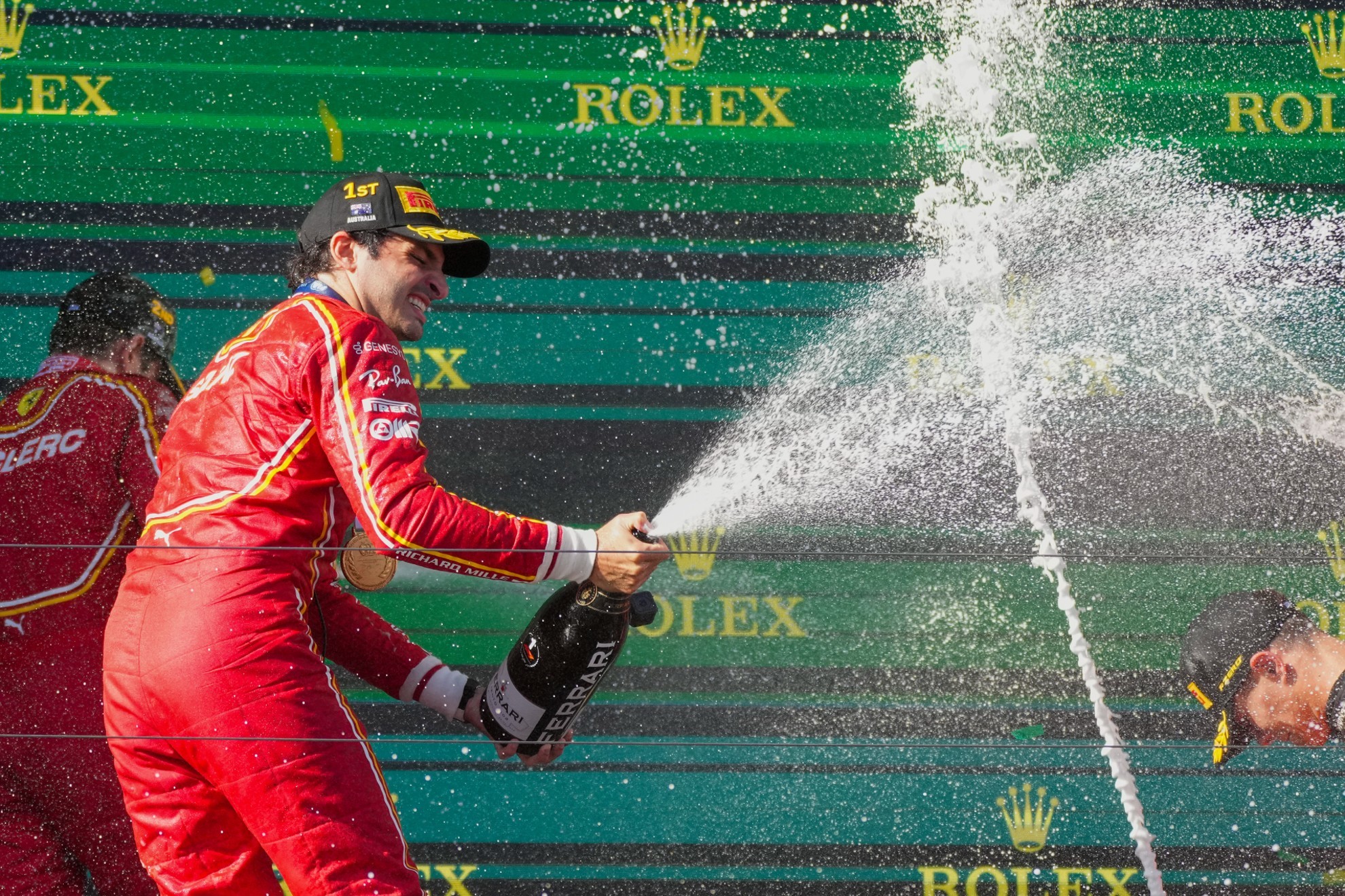 Ferrari driver Carlos Sainz of Spain sprays champagne as he celebrates after winning the Australian Formula One Grand Prix.