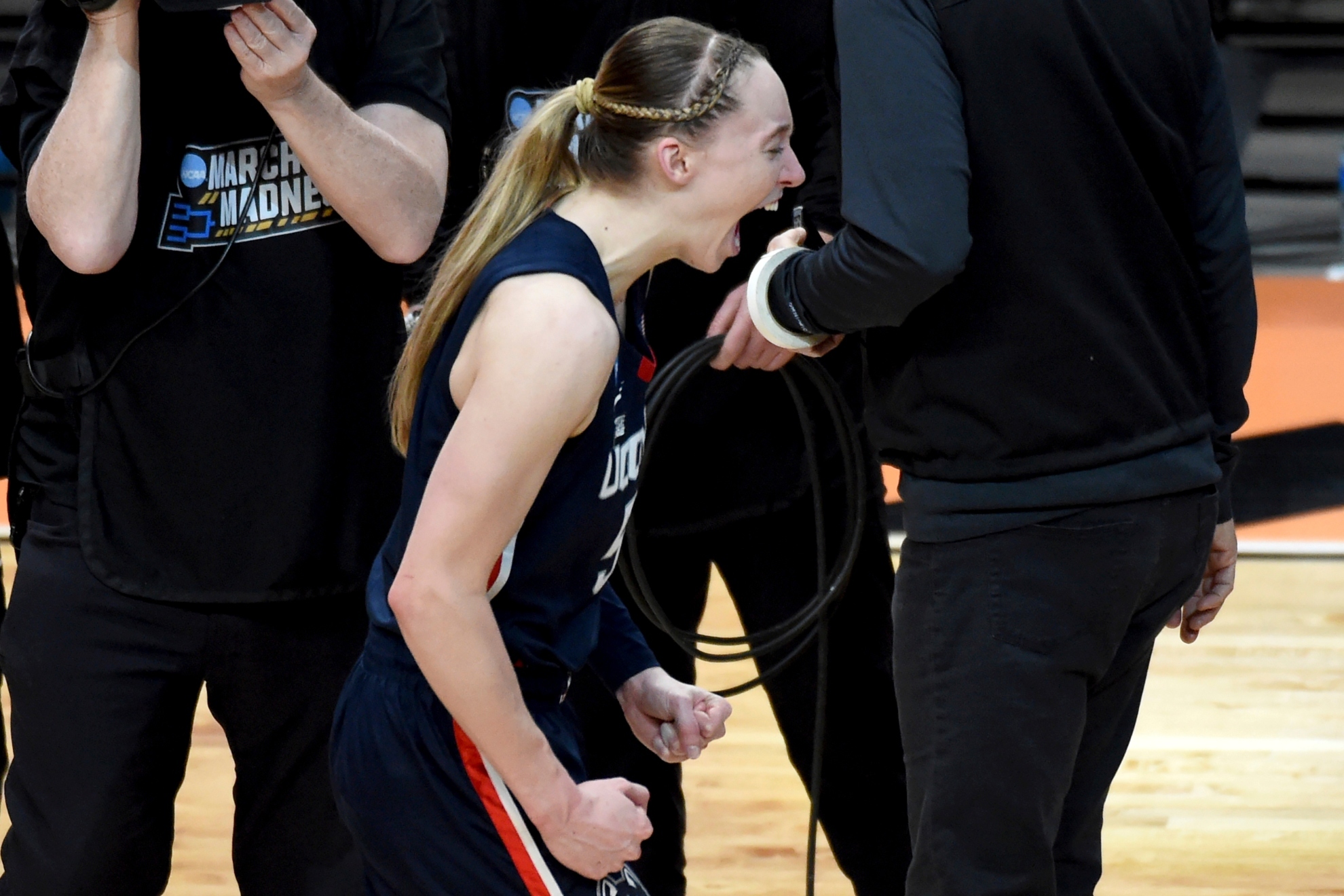 Paige Bueckers celebrates after winning an Elite Eight college basketball game against Southern California in the womens NCAA Tournament