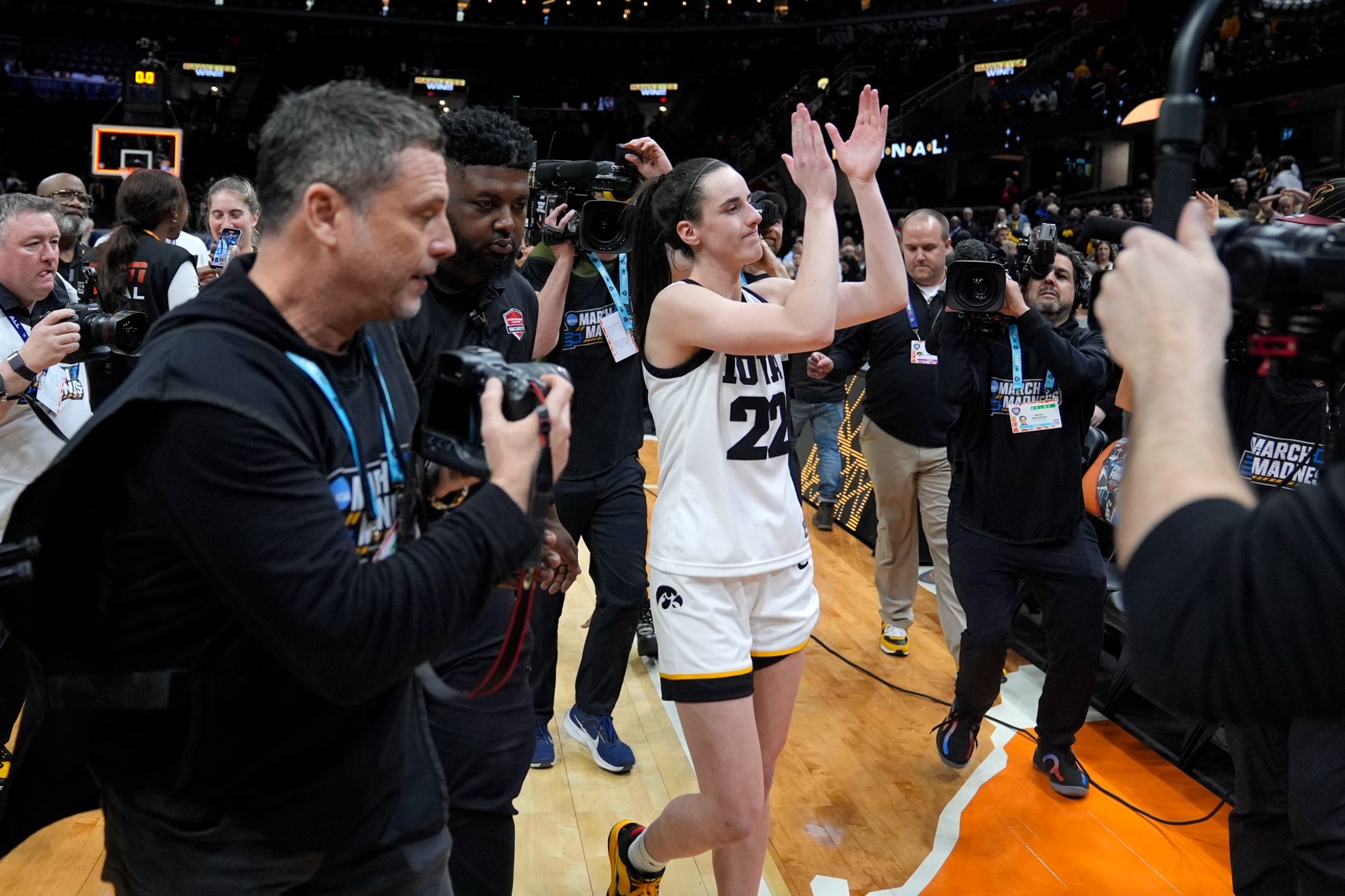 Iowa guard Caitlin Clark walks off the court after a Final Four college basketball game
