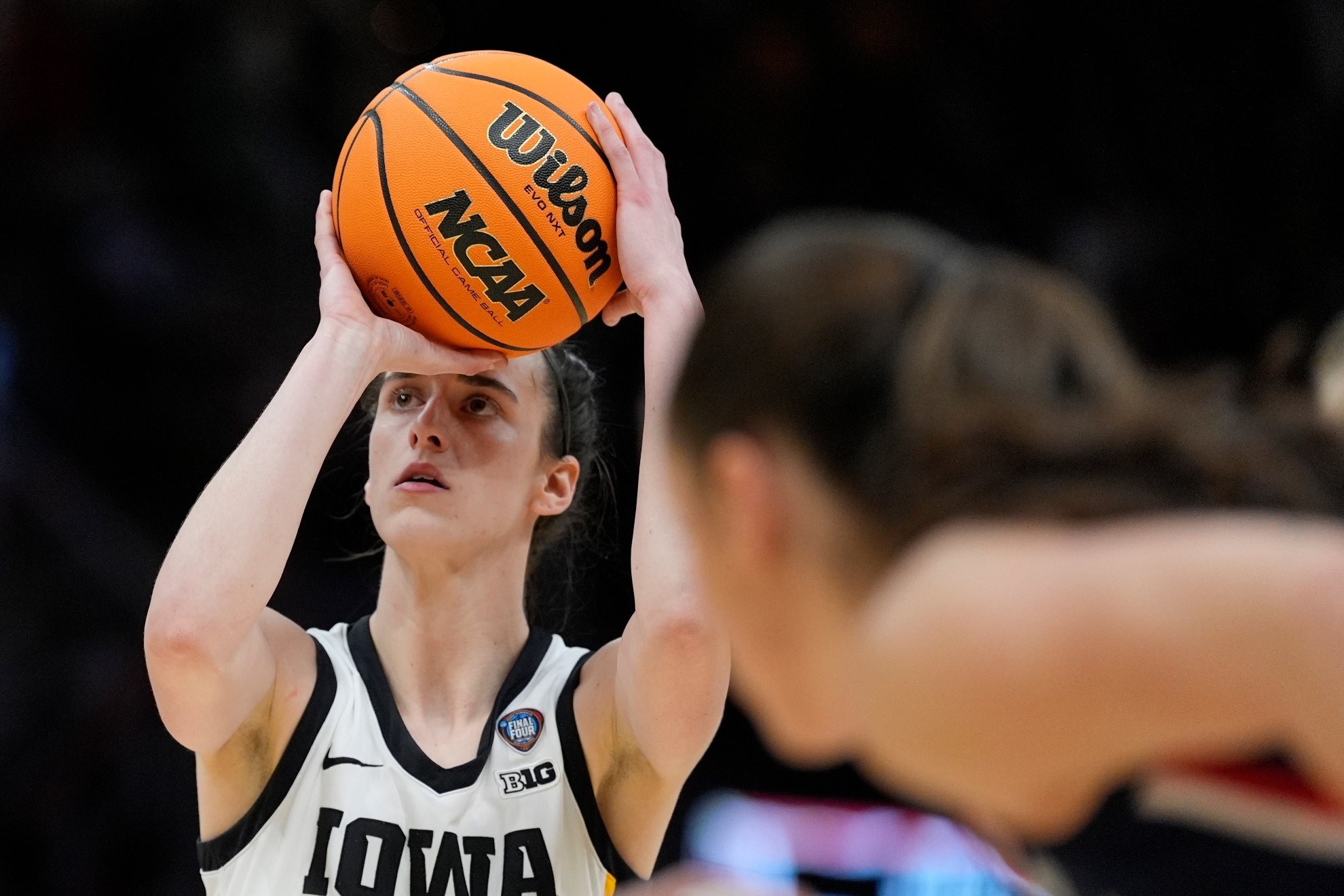 Caitlin Clark playing for the Iowa Hawkeyes