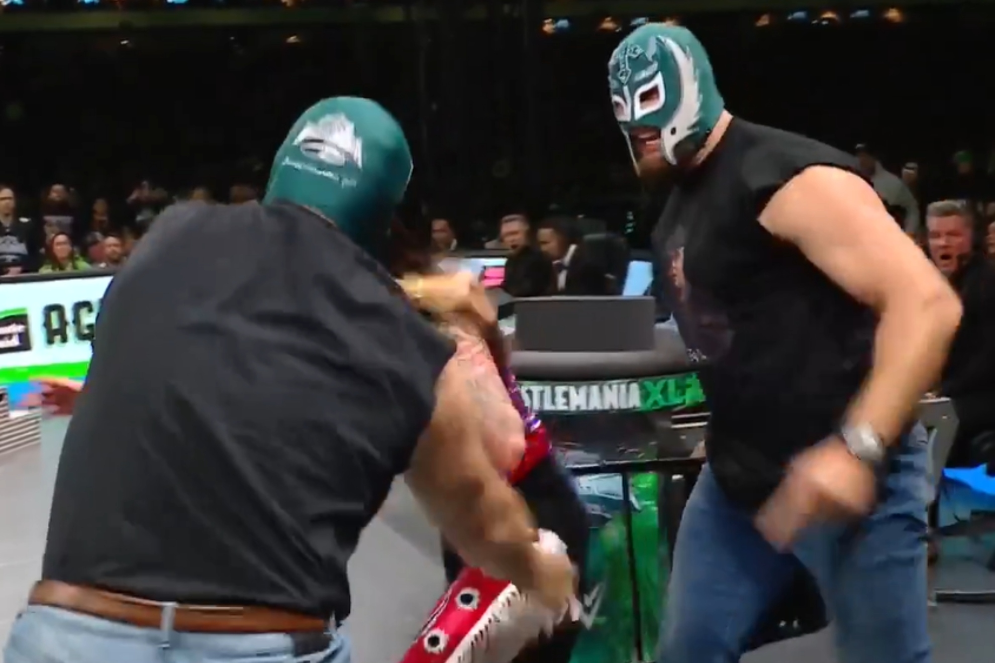 Jason Kelce, Lane Johnson save Rey Mysterio at Wrestlemania XL wearing an Eagles mask