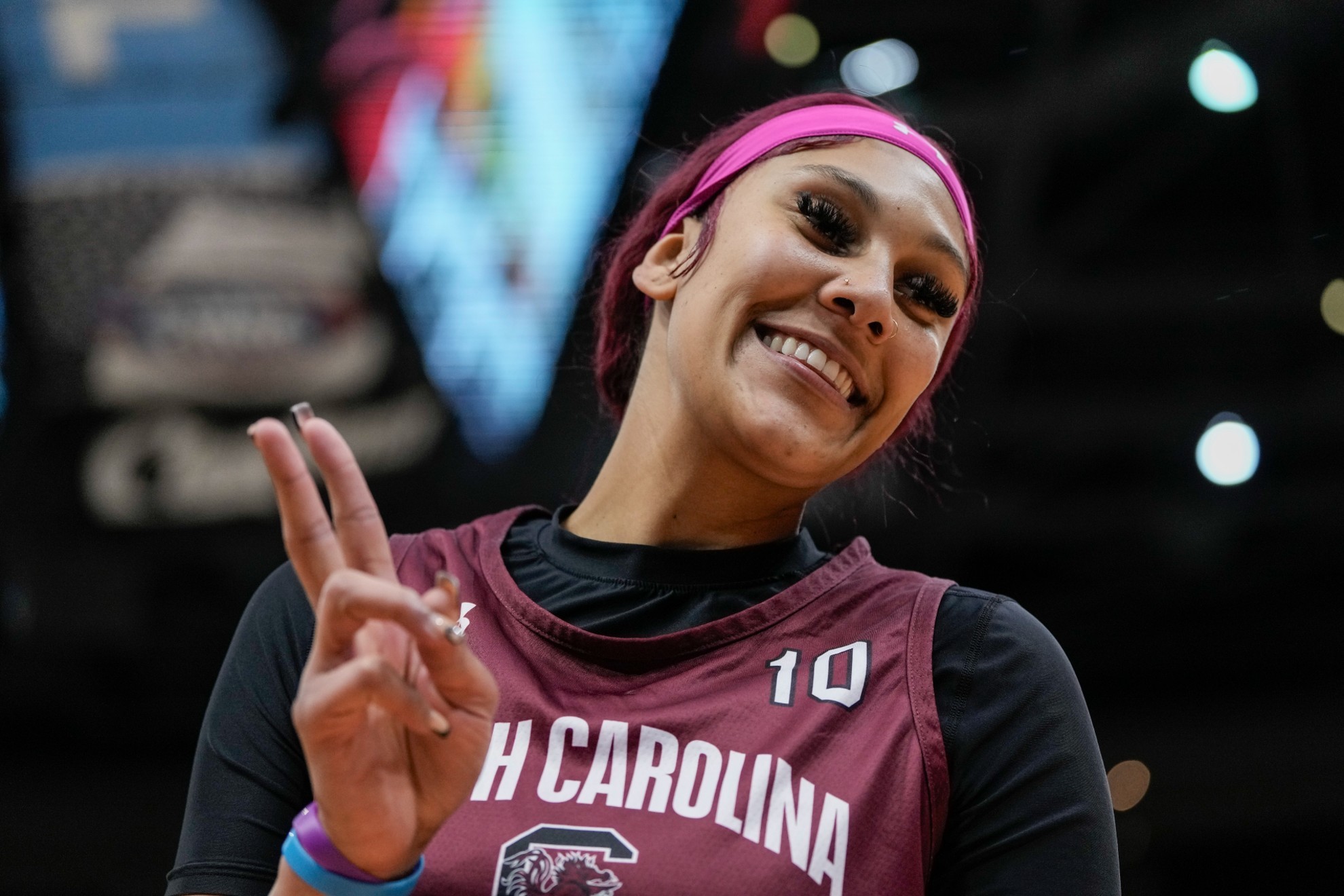 South Carolinas Kamilla Cardoso gestures to fans during practice.