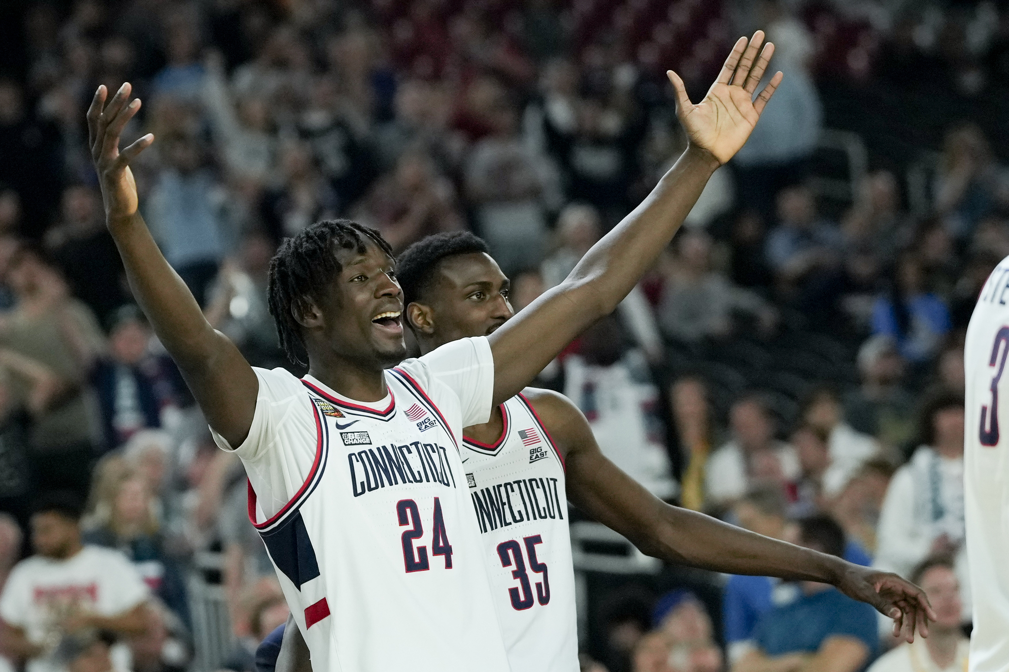 lt;HIT gt;UConn lt;/HIT gt; center Youssouf Singare (24) and forward Samson Johnson (35) celebrate after after their win against Alabama in a NCAA college basketball game at the Final Four, Saturday, April 6, 2024, in Glendale, Ariz. (AP Photo/David J. Phillip)