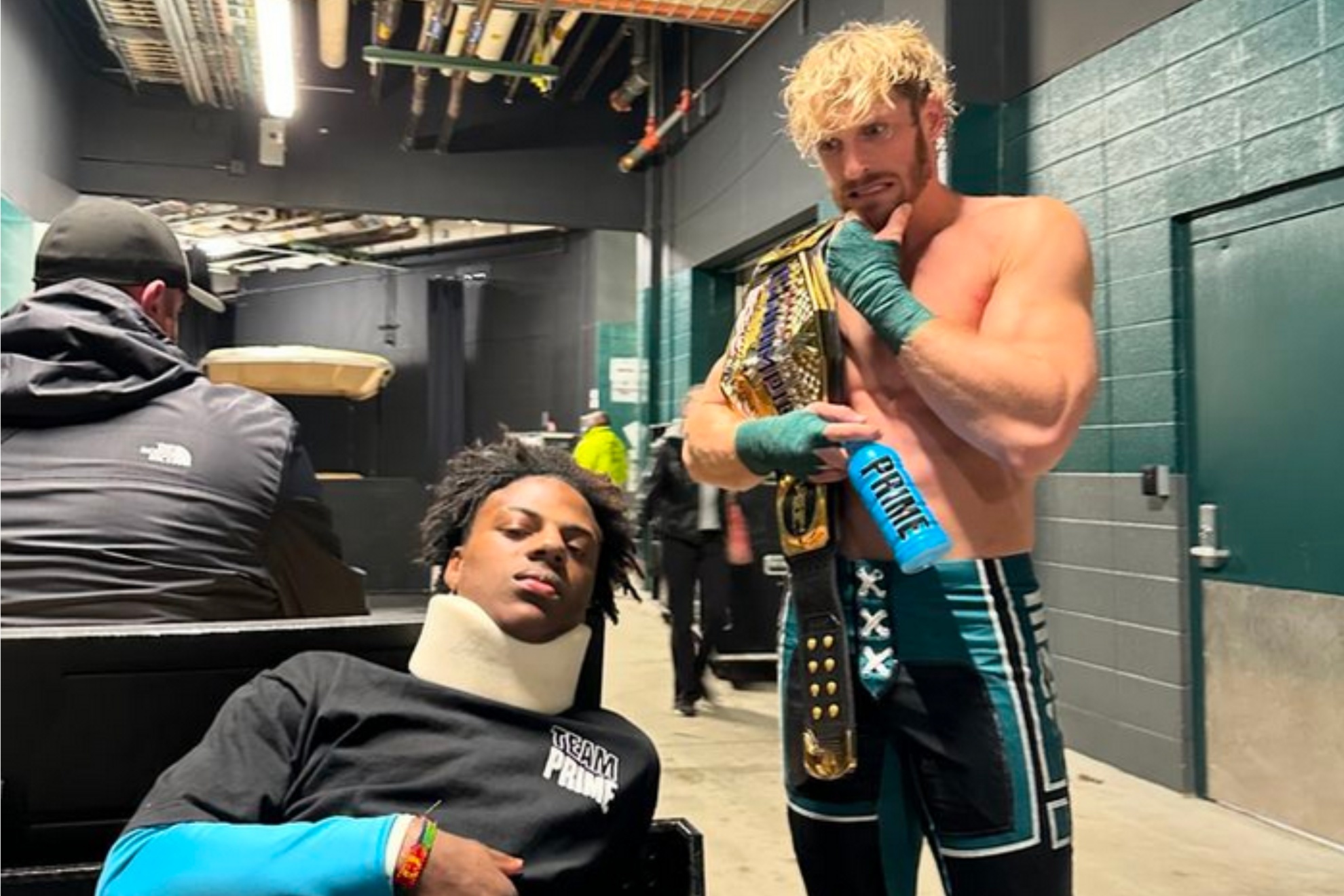 Logan Paul (R) watches IShowSpeed after the beating he received at WrestleMania XL.