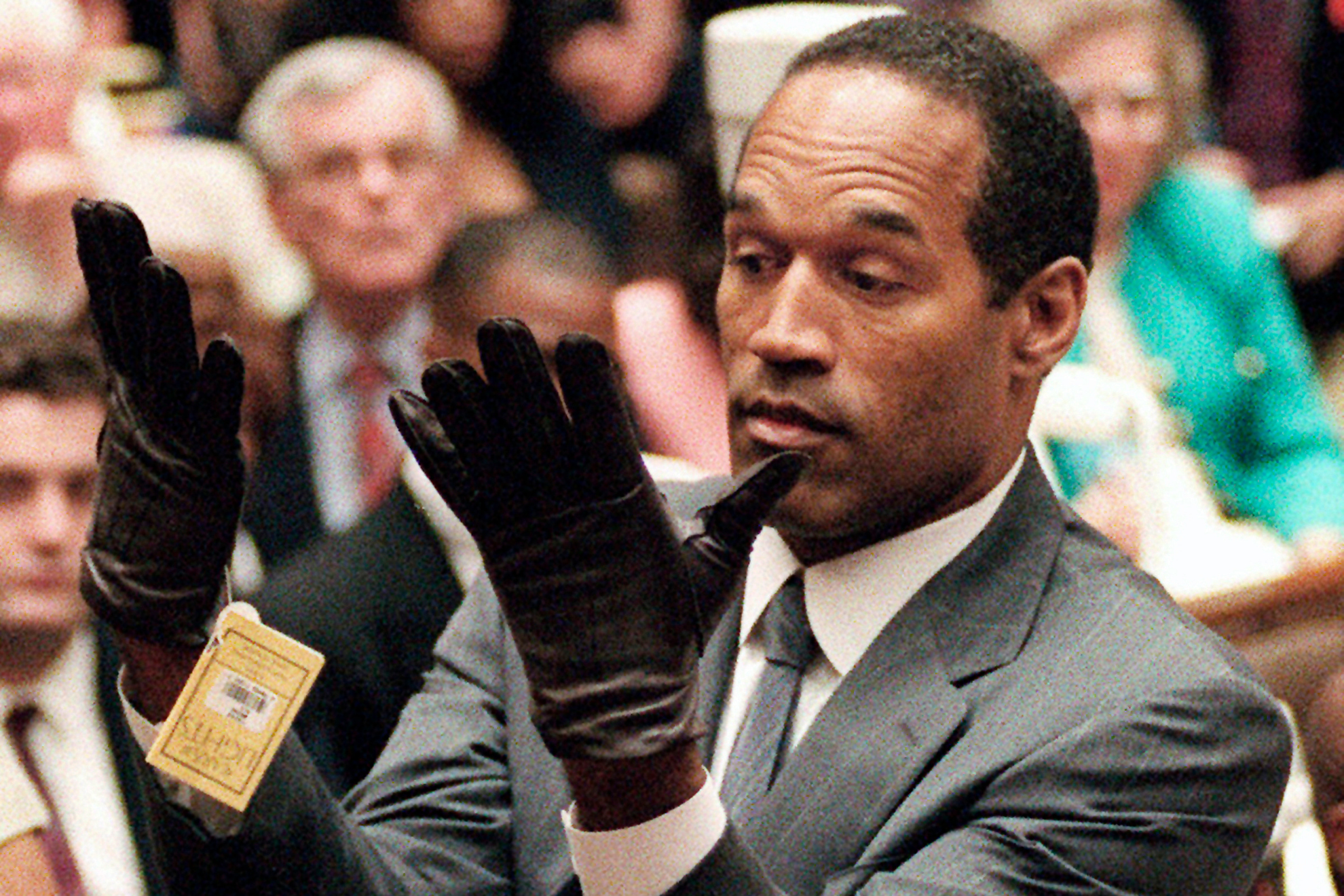 OJ Simpson tries on the gloves at his trial.