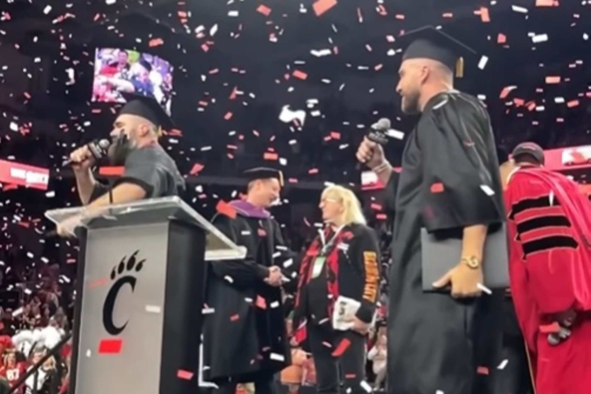 Jason (L) and Travis Kelce receiving their diplomas from the University of Cincinnati.