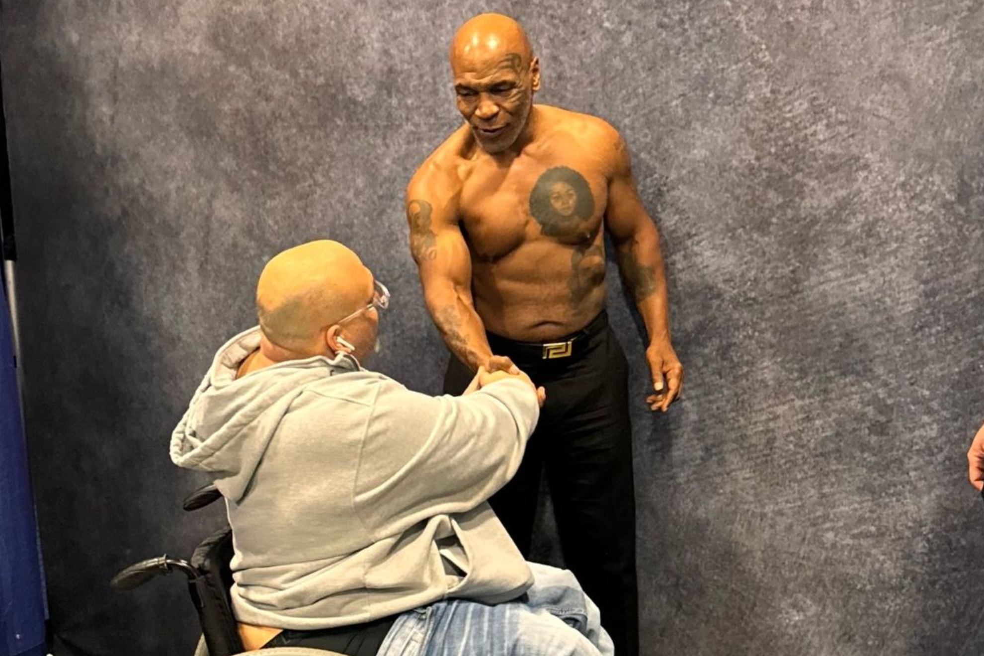 Mike Tyson greets a fan