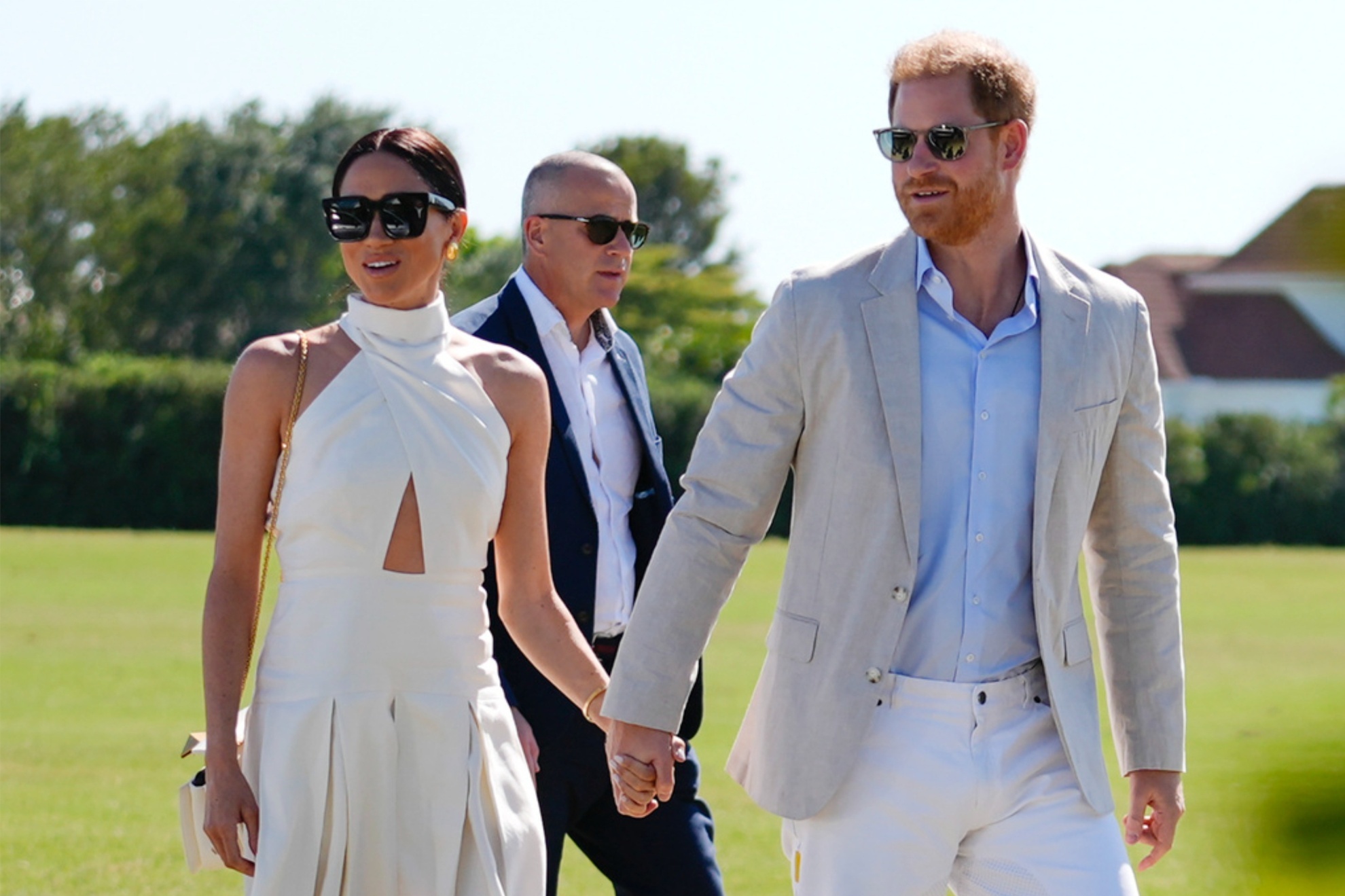 Prince Harry (R) and Meghan Markle at the 2024 Royal Salute Polo Challenge to Benefit Sentebale.