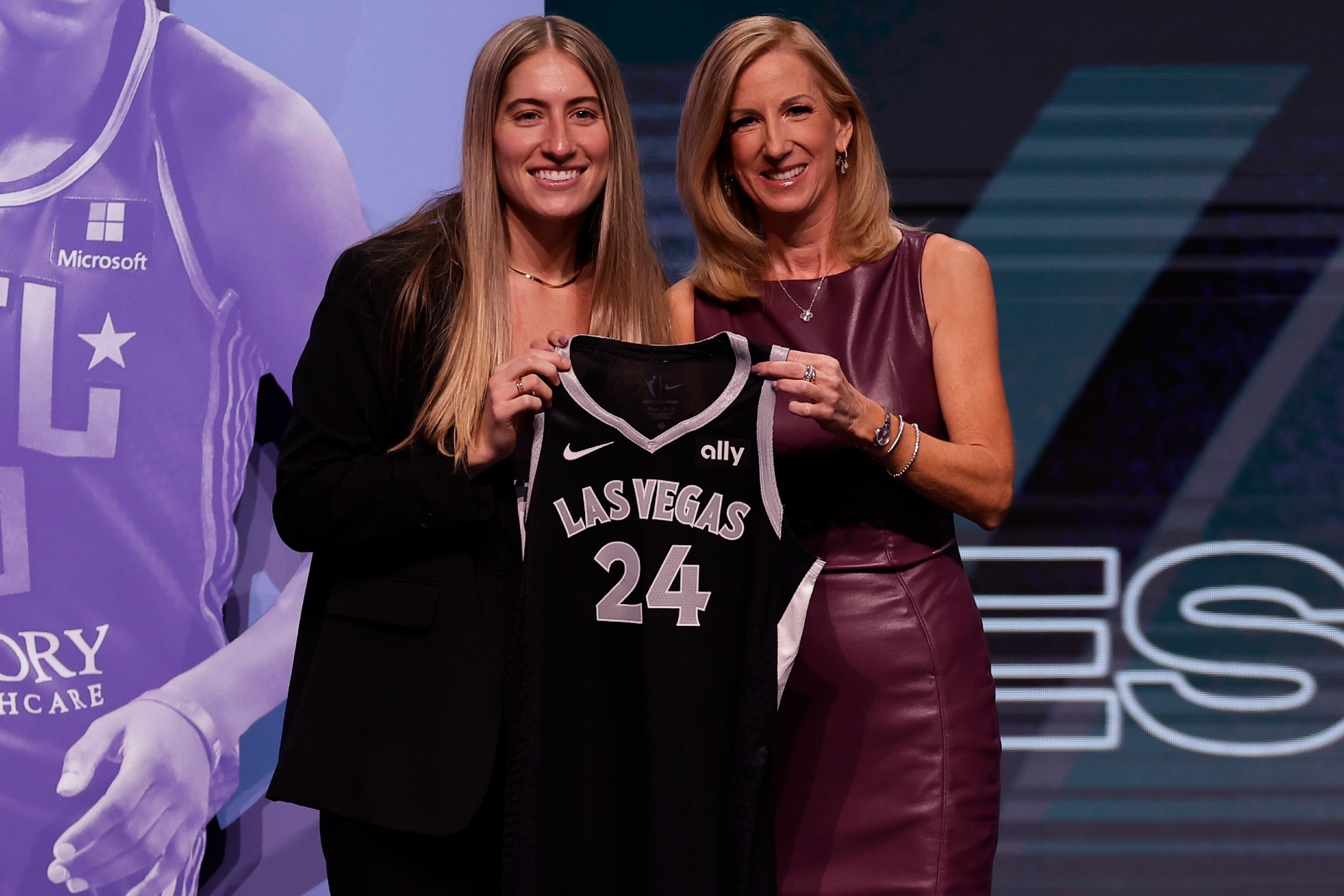 owas Kate Martin, left, poses for a photo with WNBA commissioner Cathy Engelbert.