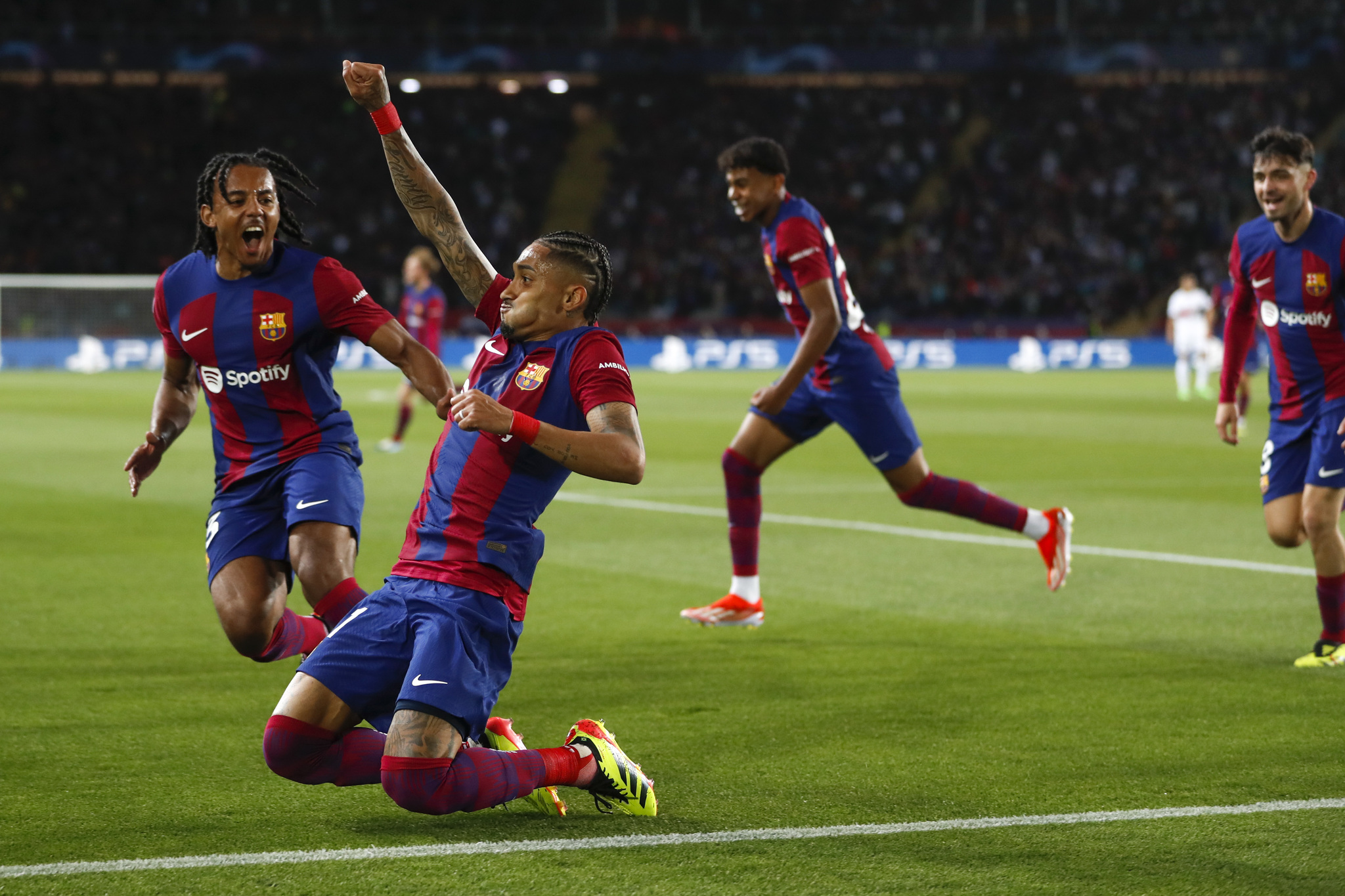 Raphinha and his Barcelona teammates celebrate after opening the scoring