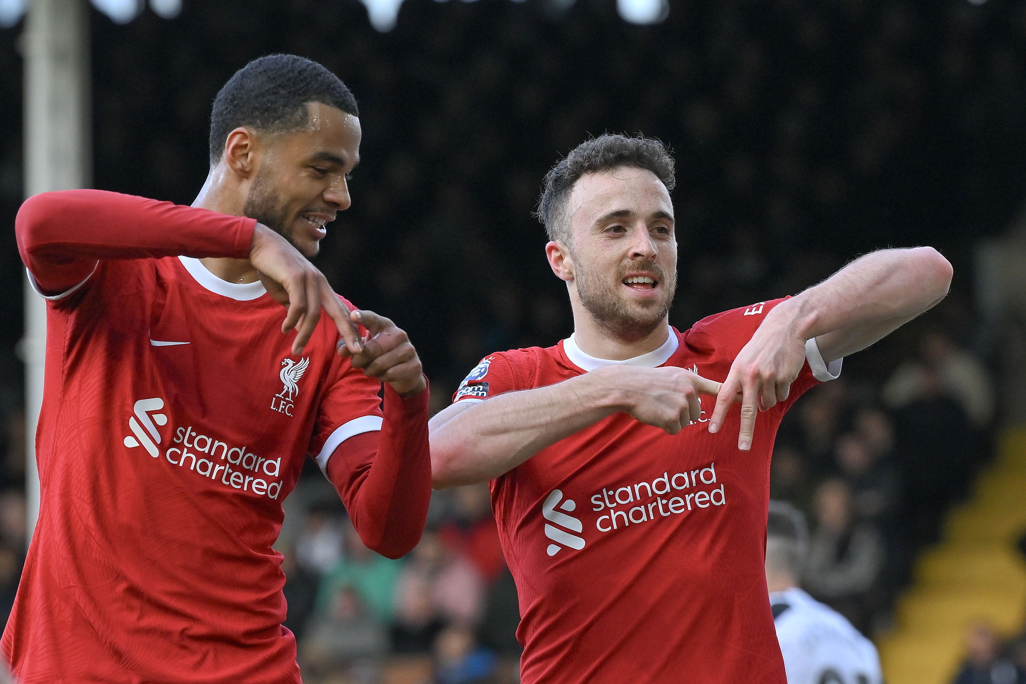 Diogo Jota celebrates after scoring with Cody Gakpo