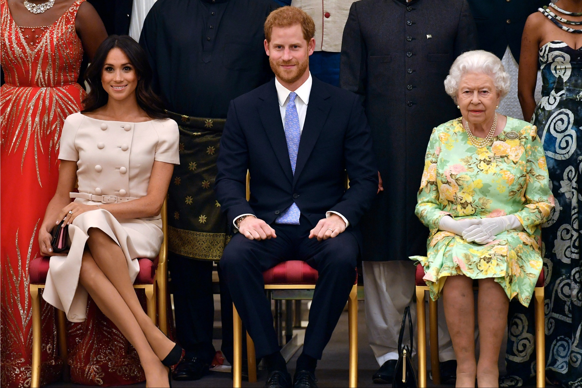 Meghan Markle, Prince Harry and the late Queen Elizabeth II.