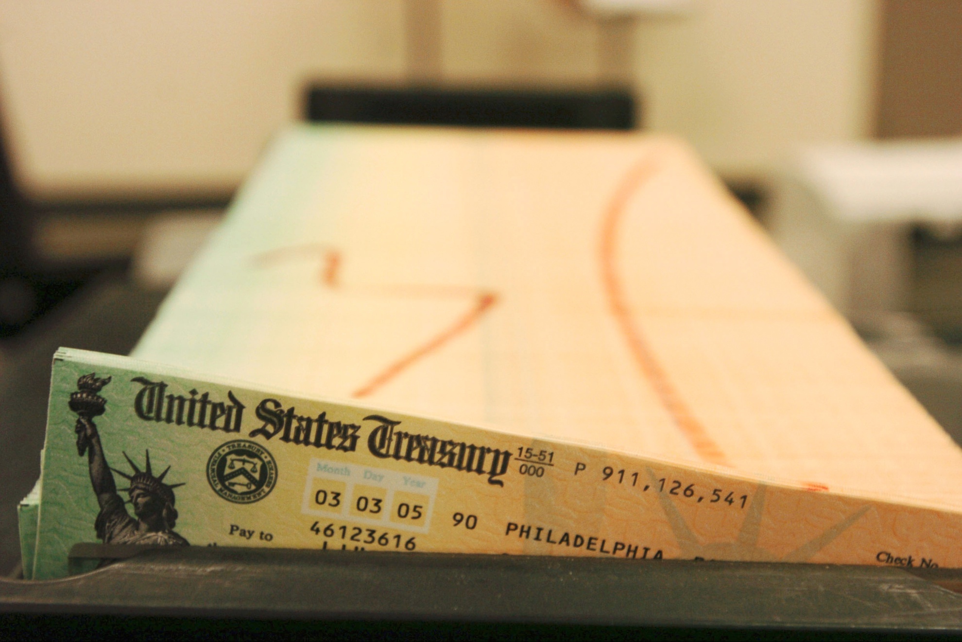 Printed social security checks wait to be mailed.