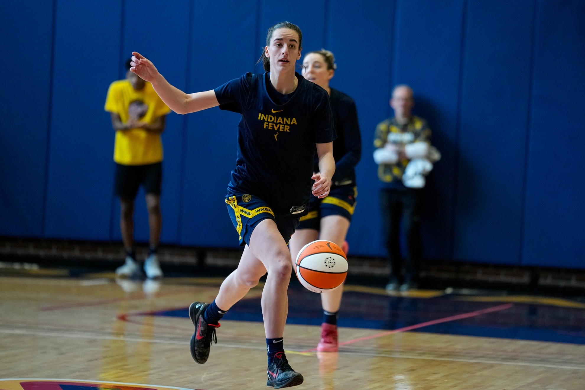 Indiana Fever guard Caitlin Clark brings the ball upcourt as the WNBA basketball team practices in Indianapolis, Sunday, April 28, 2024. (AP Photo/Michael Conroy)