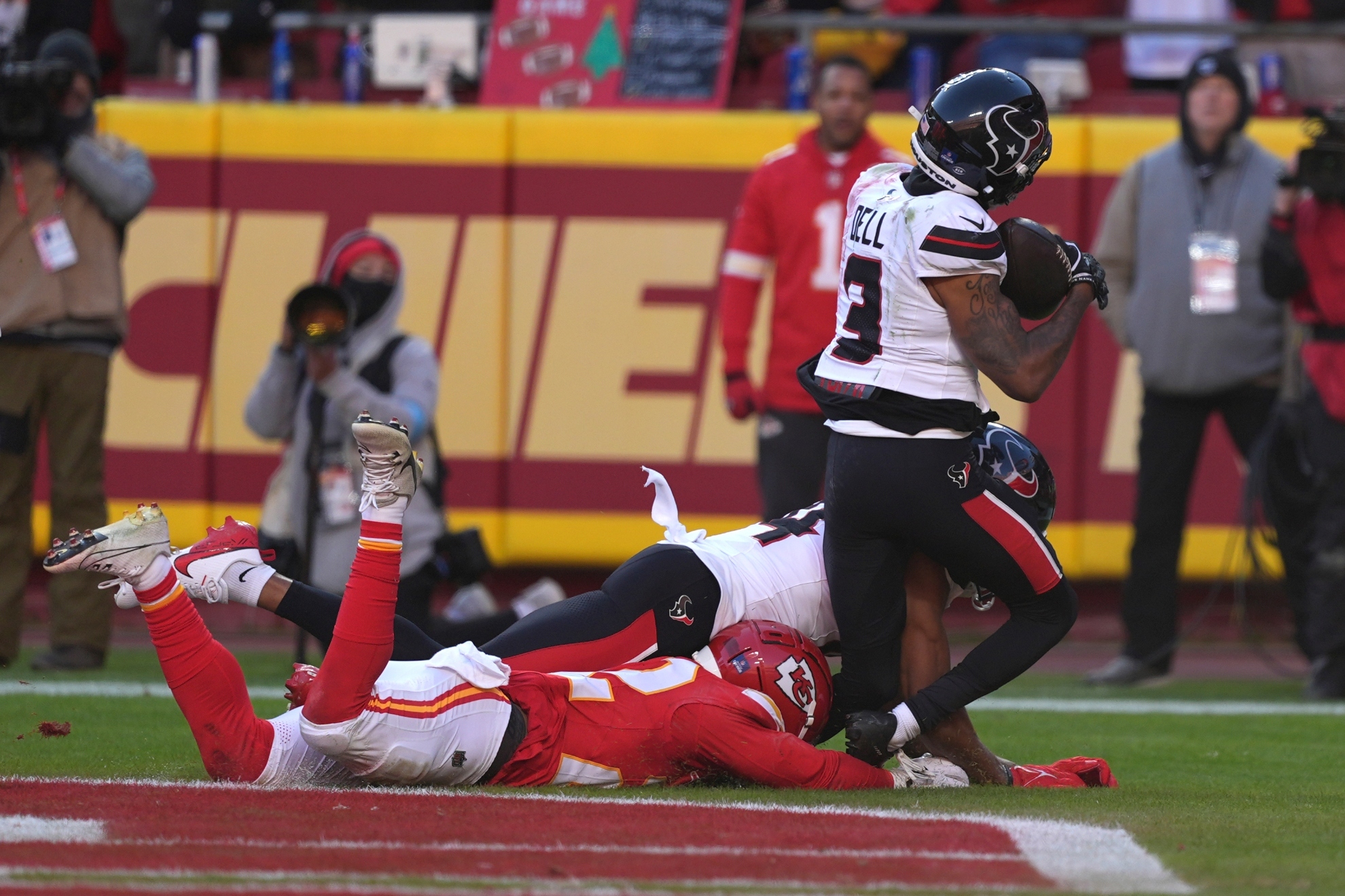 Houston Texans wide receiver Tank Dell (3) catches a touchdown pass as Kansas City Chiefs cornerback Trent McDuffie, left, defends during the second half of an NFL football game Saturday, Dec. 21, 2024, in Kansas City, Mo. Dell was injured on the play.