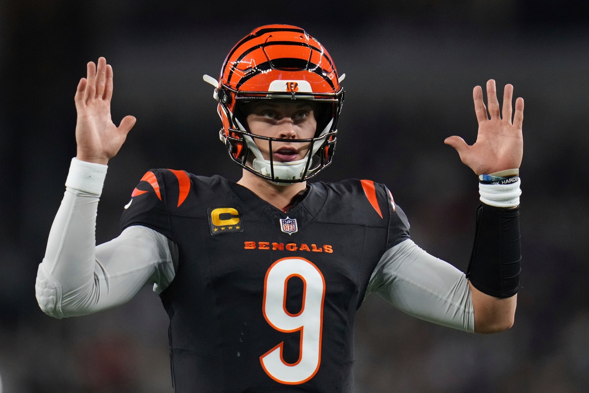 Cincinnati Bengals quarterback Joe Burrow gestures to fans during the first half of an NFL football game against the Dallas Cowboys, Monday, Dec. 9, 2024, in Arlington, Texas.