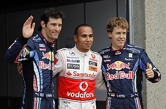 Webber y Vettel posan con Hamilton