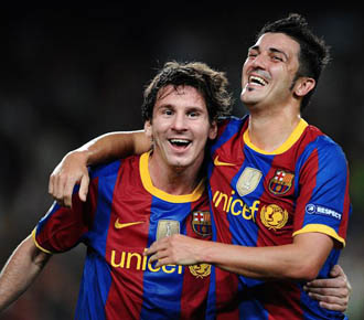 David Villa celebra un gol con el Bara junto a Leo Messi.