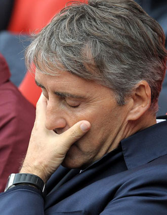 Mancini lamentandose durante un partido