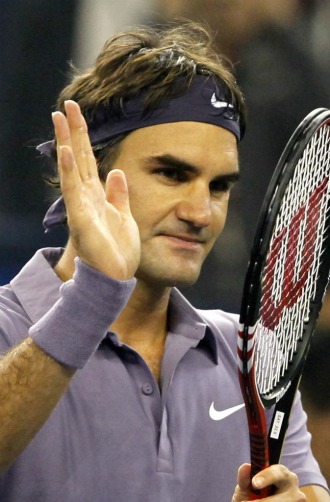 Roger Federer celebra su victoria ante Novak Djokovic.