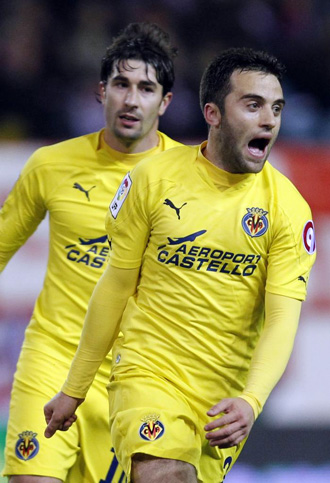 Rossi y Cani celebran un gol.