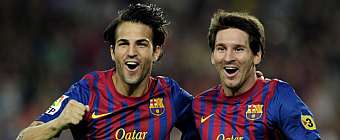 Cesc Fbregas y Lionel Messi