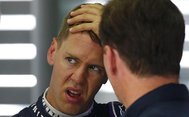 Vettel y Horner charlando en el GP de Alemania / REUTERS