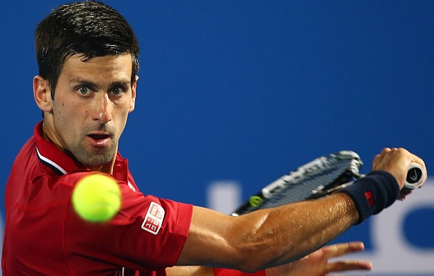 Djokovic, en pleno partido contra Wawrinka. / AFP