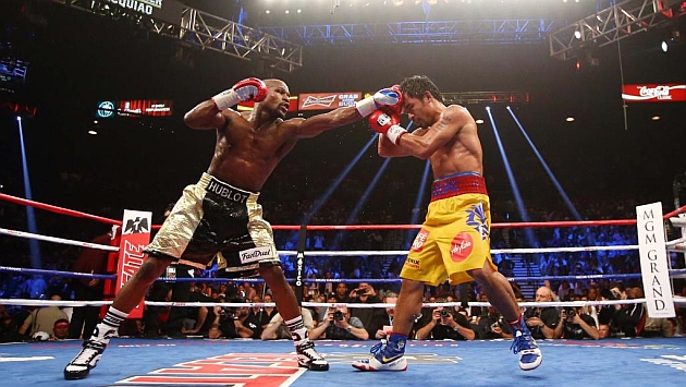 Mayweather y Pacquiao, durante el combate. Foto: USA Today Sports