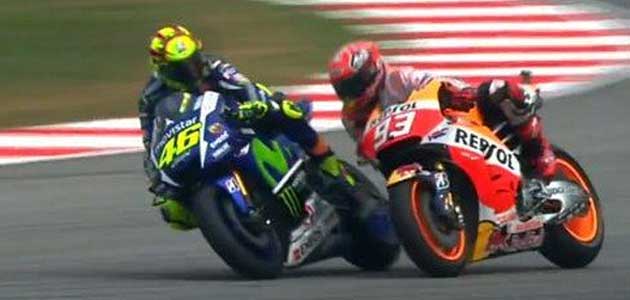 Rossi causes Márquez crash with scandalous kick